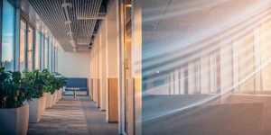A central air purifier system with vents installed in the ceiling of a modern office.
